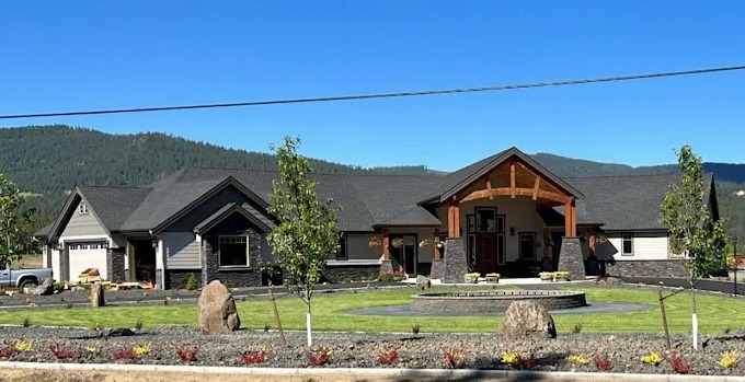 New construction home with a full fresh landscape installation
